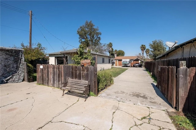 view of front of home featuring fence