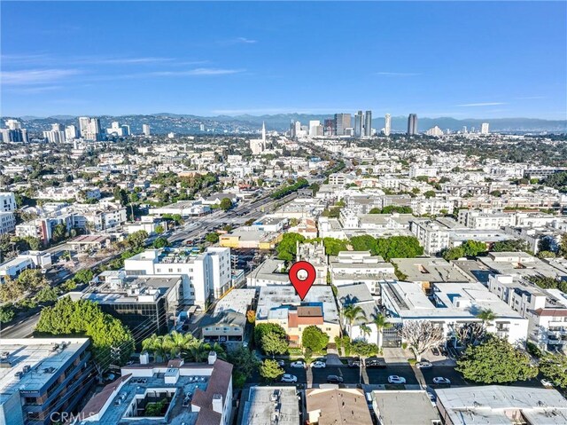 birds eye view of property featuring a city view