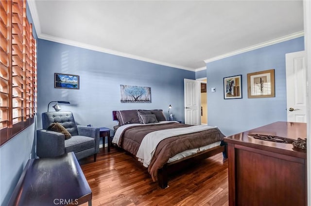 bedroom featuring dark wood finished floors and crown molding