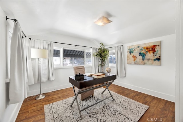 office with lofted ceiling, wood finished floors, and baseboards