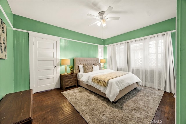 bedroom featuring dark wood-style floors and ceiling fan