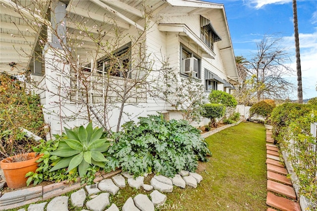 view of side of property featuring a lawn