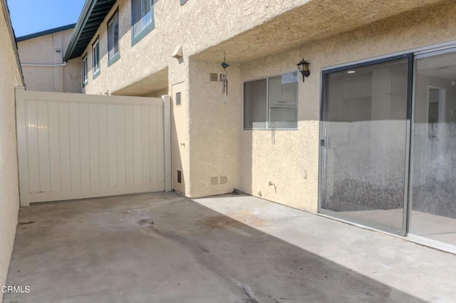 view of patio featuring fence