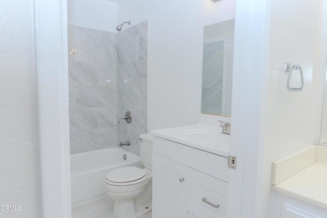 bathroom featuring vanity, toilet, and tub / shower combination