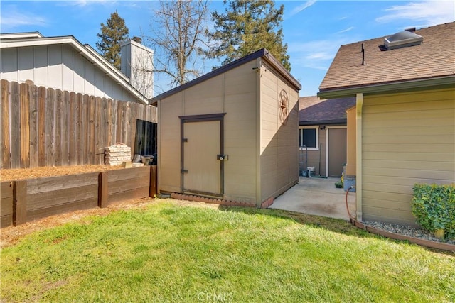 view of shed with fence