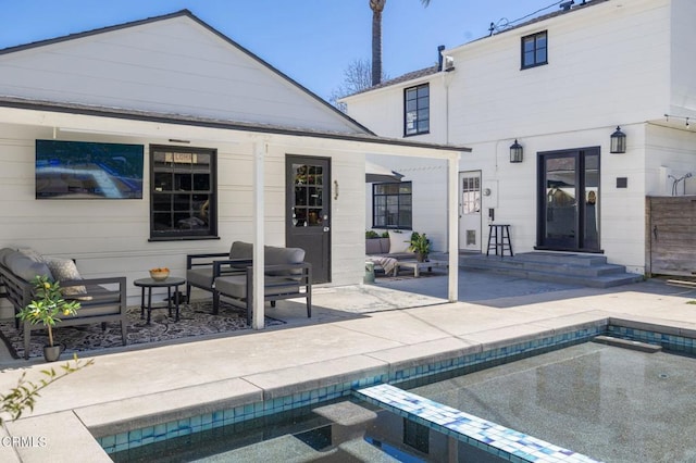 back of house with a patio, an outdoor pool, and an outdoor structure