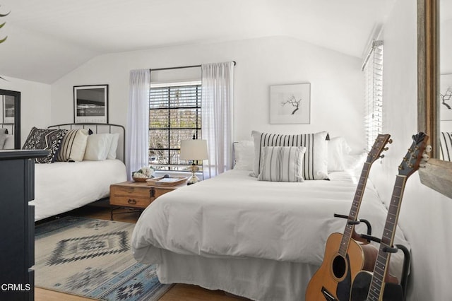 bedroom featuring lofted ceiling