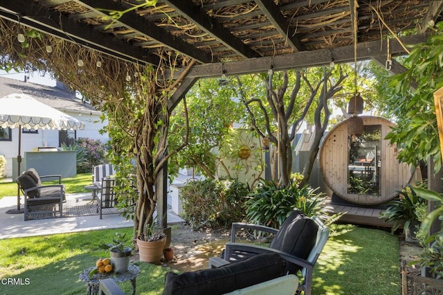 view of patio / terrace featuring an outbuilding and a storage shed