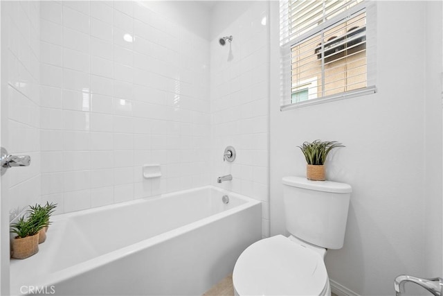 full bathroom featuring toilet and  shower combination