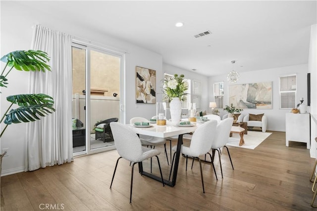 dining area with visible vents, recessed lighting, baseboards, and wood finished floors