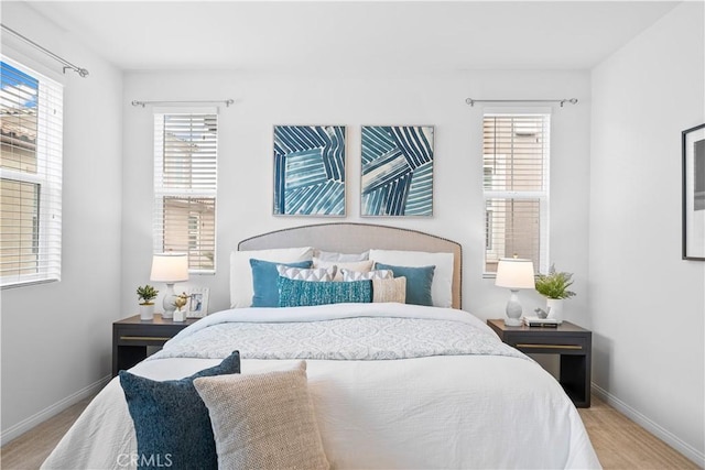 bedroom featuring baseboards