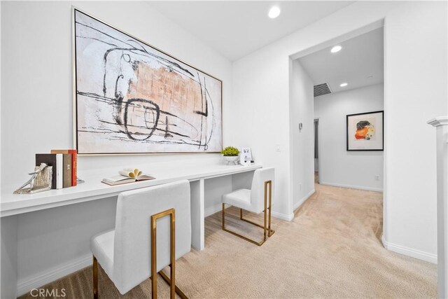 office space featuring baseboards, visible vents, carpet floors, built in study area, and recessed lighting