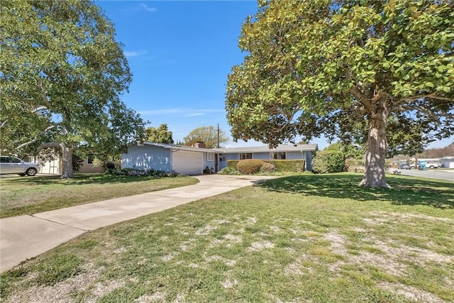 single story home with a garage, concrete driveway, and a front yard