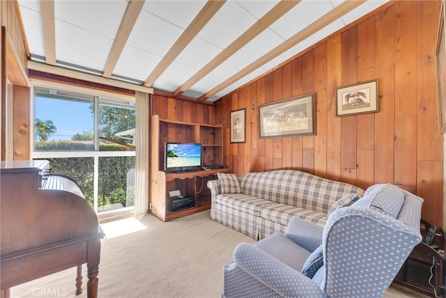 living room with lofted ceiling with beams, wooden walls, and carpet floors