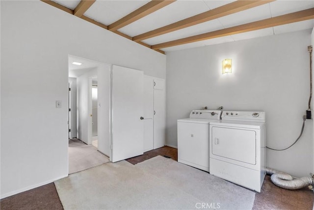 clothes washing area featuring light colored carpet, separate washer and dryer, and laundry area