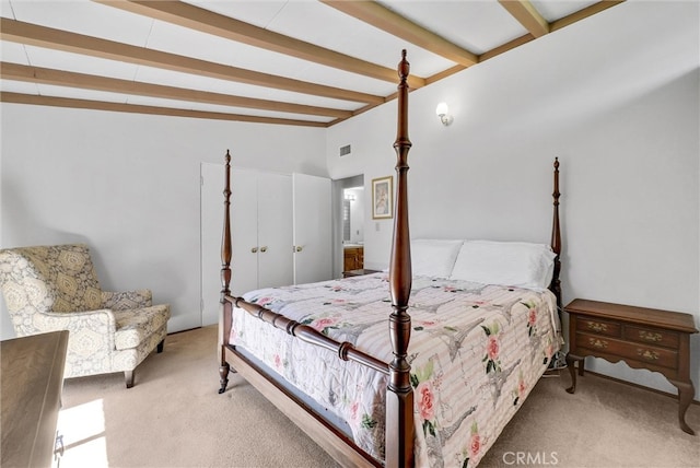 carpeted bedroom featuring visible vents and lofted ceiling with beams