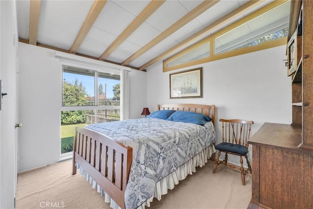 bedroom featuring vaulted ceiling with beams and carpet