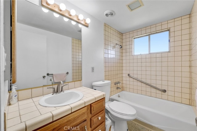 full bathroom with vanity, bathing tub / shower combination, and toilet