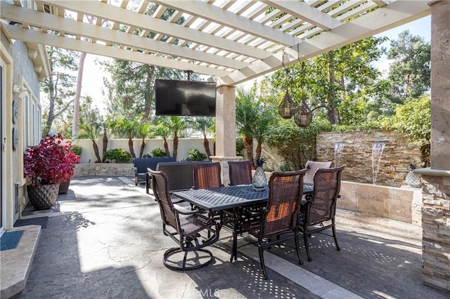 view of patio / terrace with outdoor dining space, a fenced backyard, and a pergola