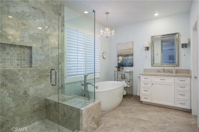 full bath with vanity, a shower stall, a soaking tub, and a notable chandelier