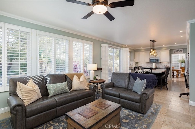 living room featuring recessed lighting, baseboards, a ceiling fan, and crown molding