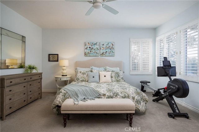 bedroom with baseboards, carpet, and a ceiling fan