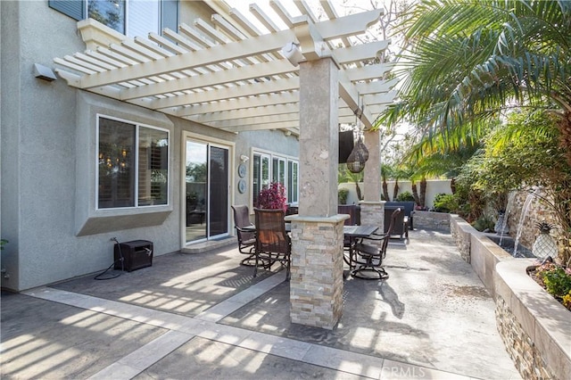 view of patio with outdoor dining space and fence