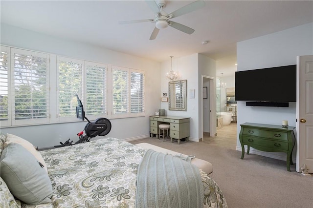 bedroom featuring ceiling fan with notable chandelier, baseboards, and light carpet