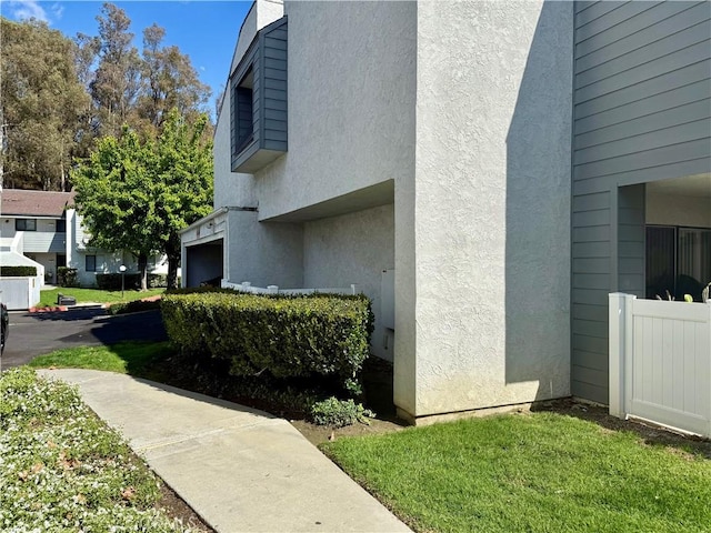 view of side of property featuring stucco siding