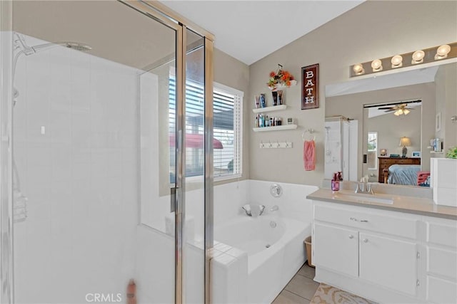 ensuite bathroom with ceiling fan, a garden tub, a stall shower, tile patterned floors, and ensuite bath