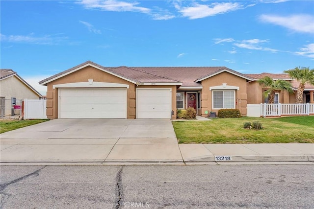 ranch-style house featuring stucco siding, a front yard, a garage, and fence