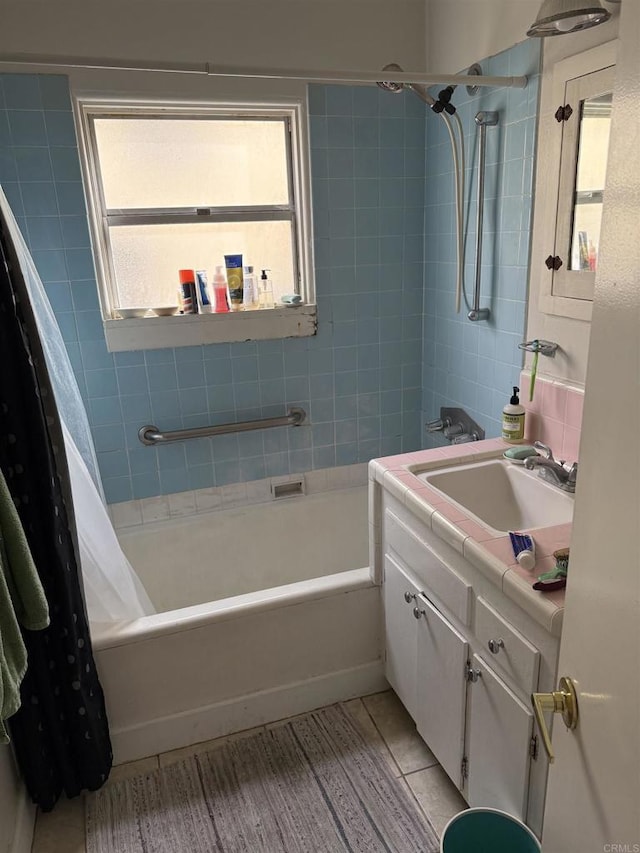 bathroom with vanity, tile patterned floors, and shower / tub combo with curtain