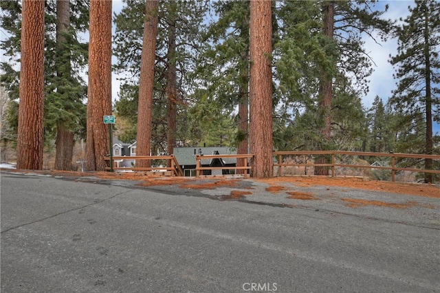 view of front of property featuring fence