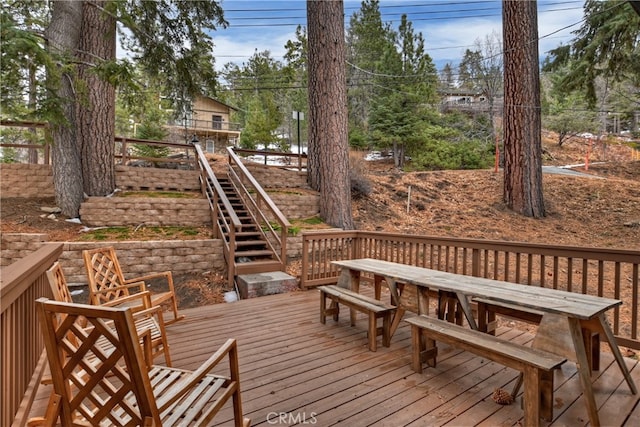 wooden terrace featuring stairs