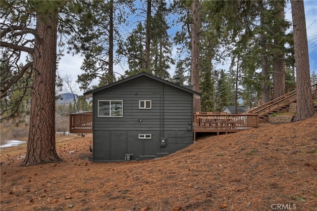 view of home's exterior featuring a deck