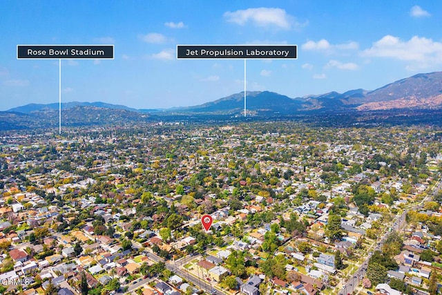 drone / aerial view featuring a mountain view and a residential view