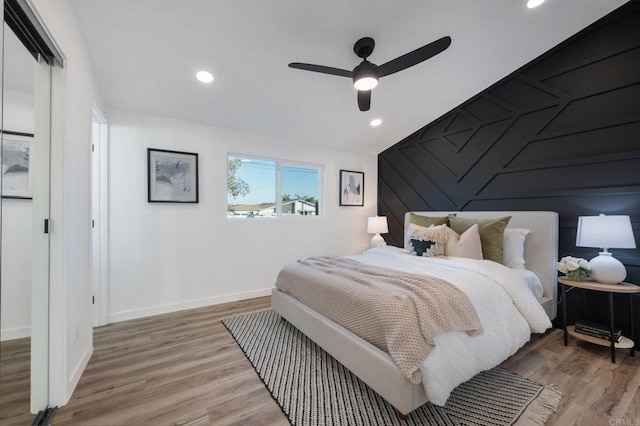 bedroom with a ceiling fan, light wood-style flooring, recessed lighting, and baseboards