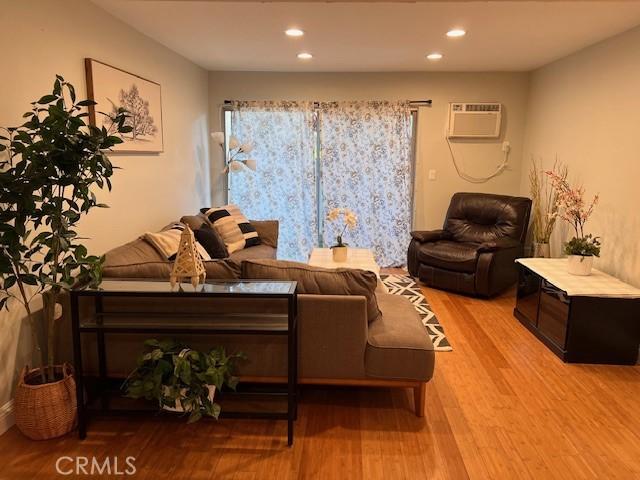 28947 Thousand Oaks Blvd Unit 134, Agoura Hills, CA 91301 - living area featuring a wall unit AC, wood finished floors, and recessed lighting