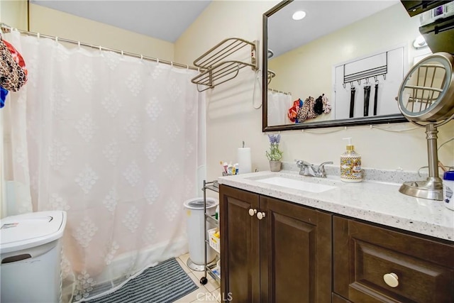 bathroom with tile patterned flooring, a shower with curtain, toilet, and vanity