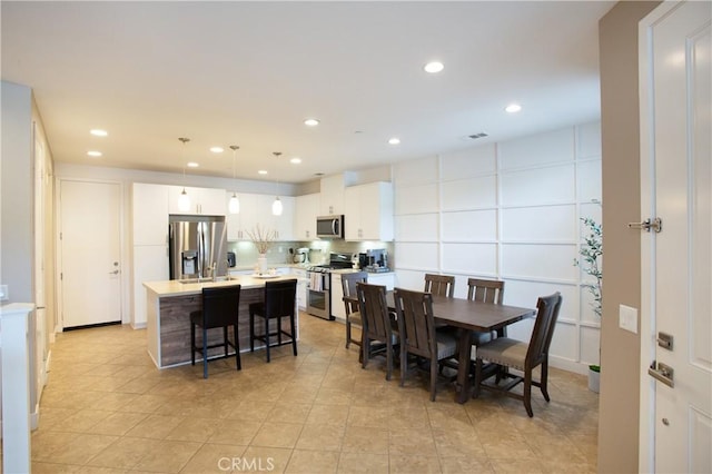 dining area with recessed lighting, visible vents, and light tile patterned floors