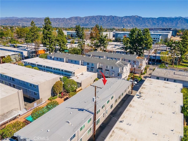 birds eye view of property with a mountain view