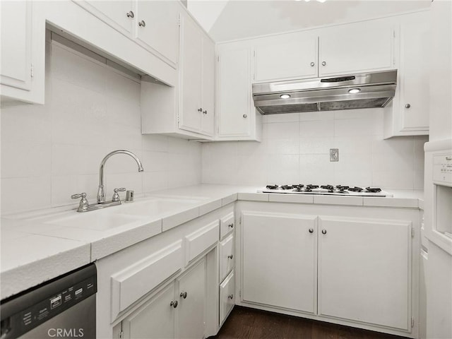 kitchen with white gas cooktop, a sink, light countertops, under cabinet range hood, and stainless steel dishwasher