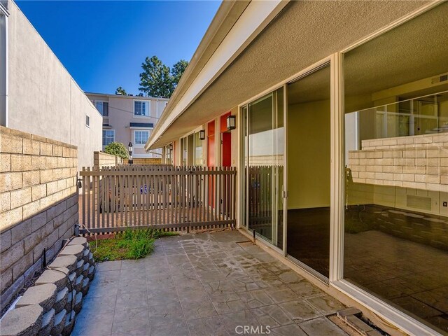 view of patio featuring fence