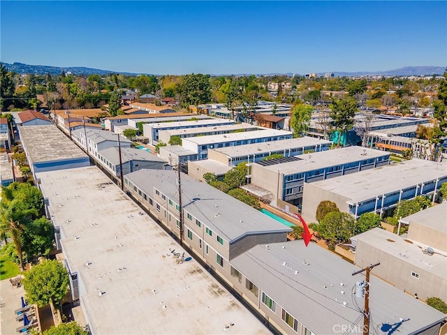 birds eye view of property featuring a mountain view