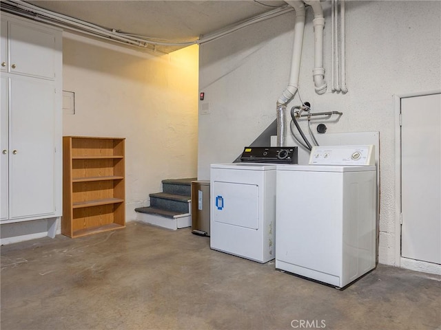 washroom with separate washer and dryer and laundry area