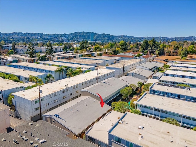 birds eye view of property with a mountain view