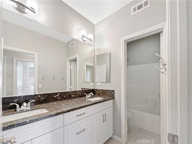 bathroom with tile patterned flooring, visible vents, and a sink