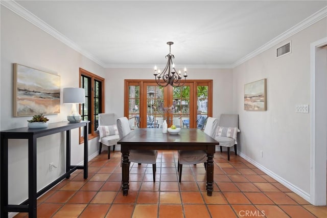 dining room featuring visible vents, baseboards, a chandelier, and ornamental molding