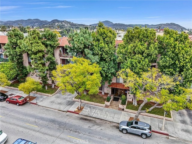 birds eye view of property with a mountain view