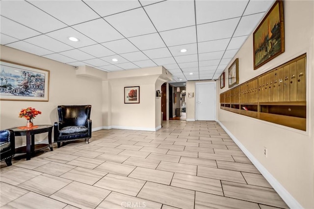 interior space featuring recessed lighting, a paneled ceiling, and baseboards